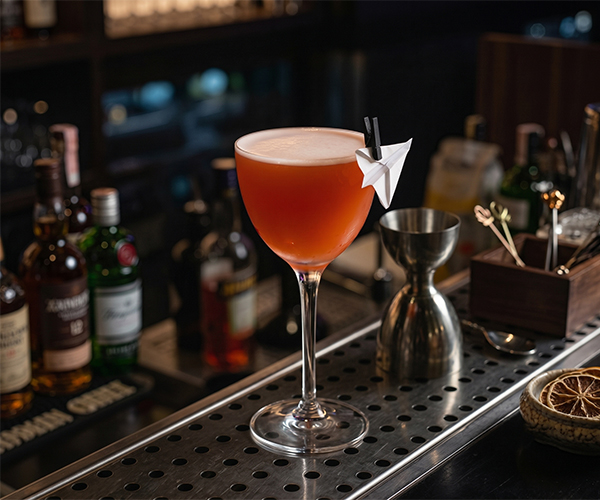 Paper Plane herbal cocktail with free spirit bourbon