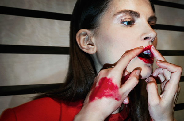 Surveillance-style fashion photography artwork on display